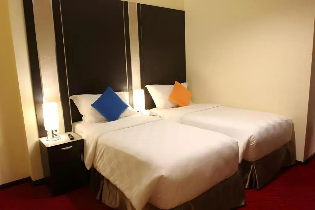 Bed in Sunbreeze Hotel Bed in Sunbreeze Hotel