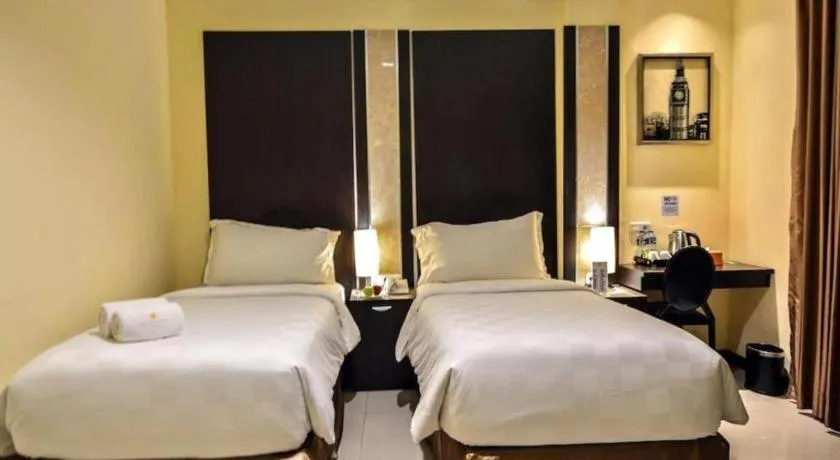 Bed in Sunbreeze Hotel