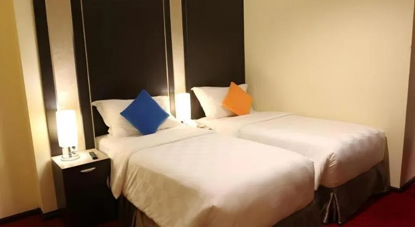 Bed in Sunbreeze Hotel