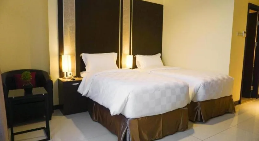 Bed in Sunbreeze Hotel