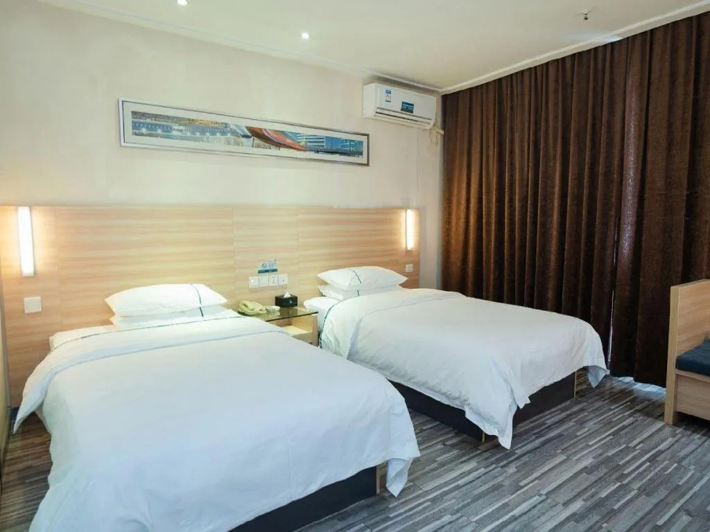 Bed in City Comfort Inn Yichang Gezhouba CBD Shopping Center