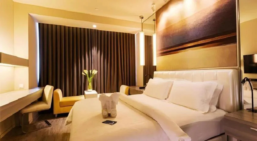 Bed in Jinjiang Metropolo Hotel - Qingdao Chengyang District Government