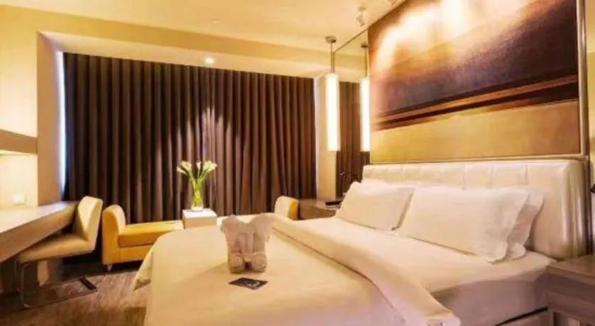 Bed in Jinjiang Metropolo Hotel - Qingdao Chengyang District Government