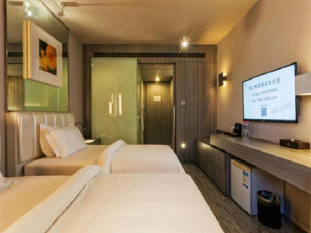 Bed in Jinjiang Metropolo Hotel - Qingdao Chengyang District Government