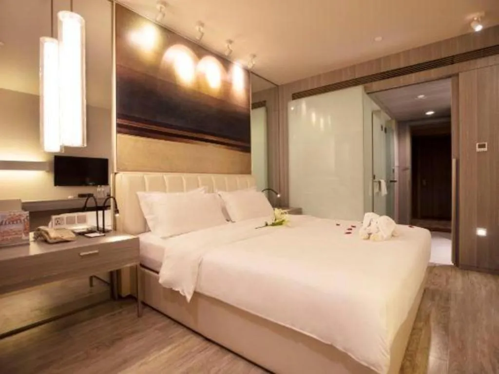 Bed in Jinjiang Metropolo Hotel - Qingdao Chengyang District Government