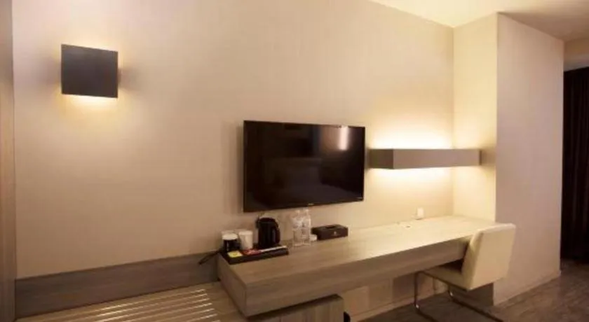 Bed in Jinjiang Metropolo Hotel - Qingdao Chengyang District Government