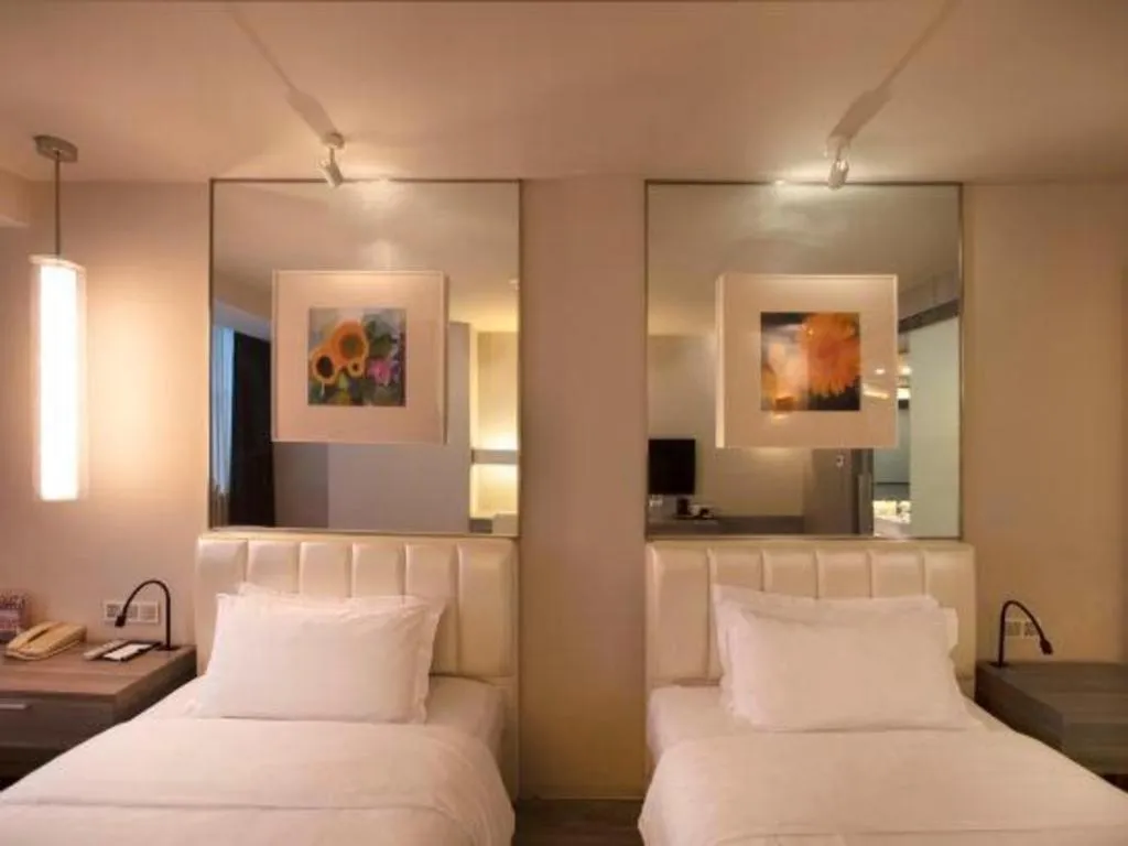 Bed in Jinjiang Metropolo Hotel - Qingdao Chengyang District Government