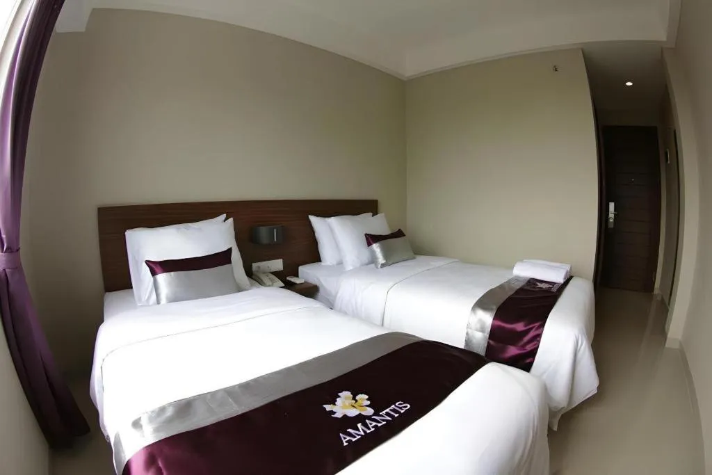 Bed in Amantis Hotel