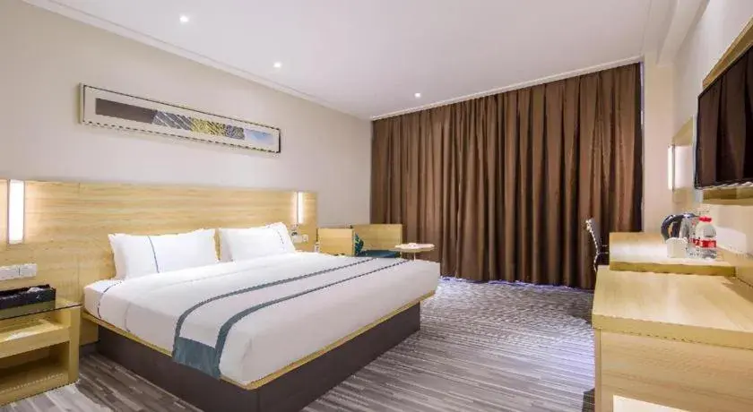 Bed in City Comfort Inn Guangzhou Baiyun Mountain Bed in City Comfort Inn Guangzhou Baiyun Mountain