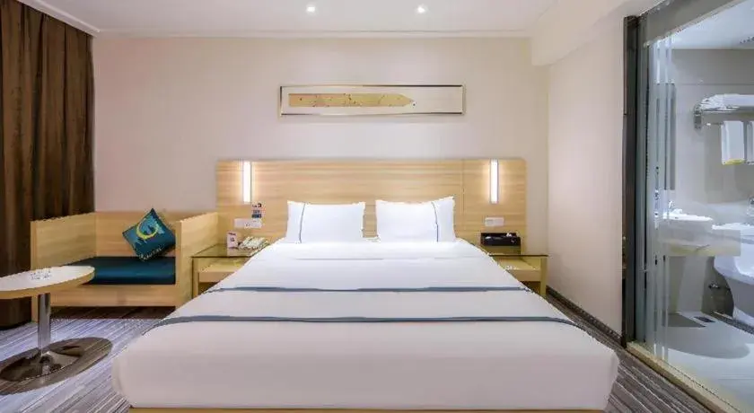 Bed in City Comfort Inn Guangzhou Baiyun Mountain Bed in City Comfort Inn Guangzhou Baiyun Mountain