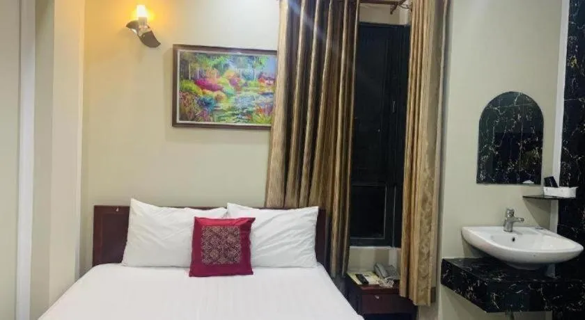 Bed in Mi Linh Hotel