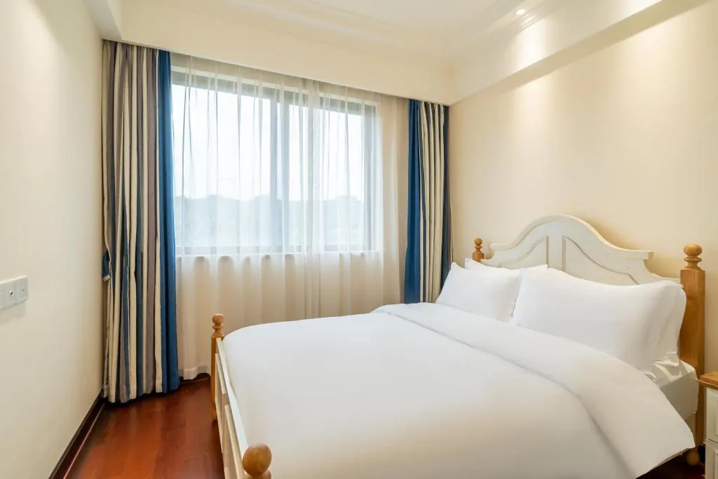 Bed in Poltton International Service Apartment Fujian Changtai Mayangxi