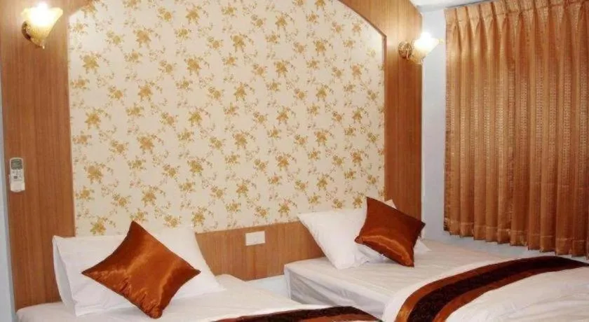 Bed in Diamond Sweet Hotel