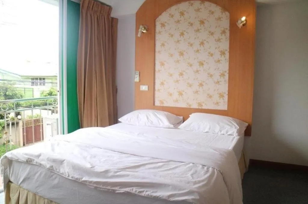 Bed in Diamond Sweet Hotel