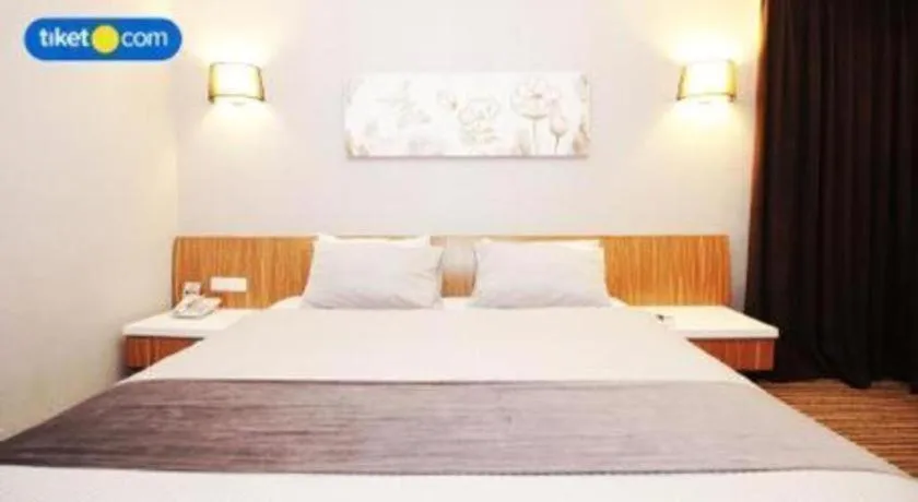 Bed in Kenari Tower Hotel