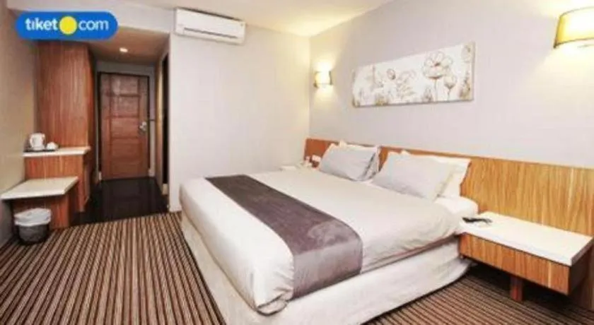 Bed in Kenari Tower Hotel