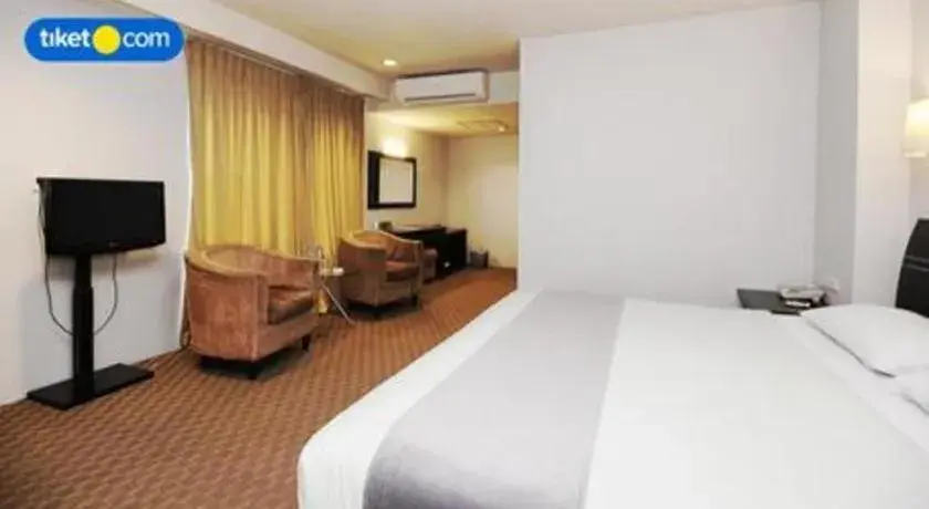 Bed in Kenari Tower Hotel Bed in Kenari Tower Hotel