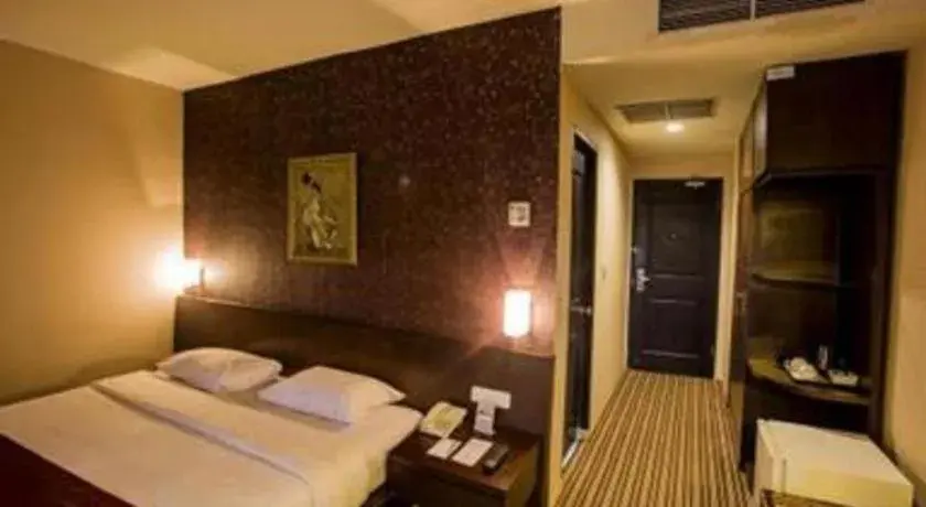 Bed in Kenari Tower Hotel Bed in Kenari Tower Hotel