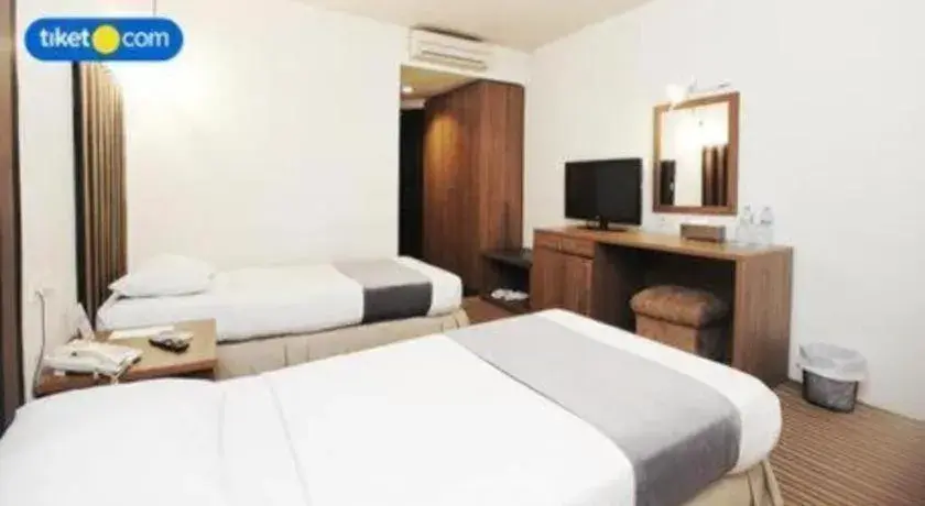 Bed in Kenari Tower Hotel Bed in Kenari Tower Hotel