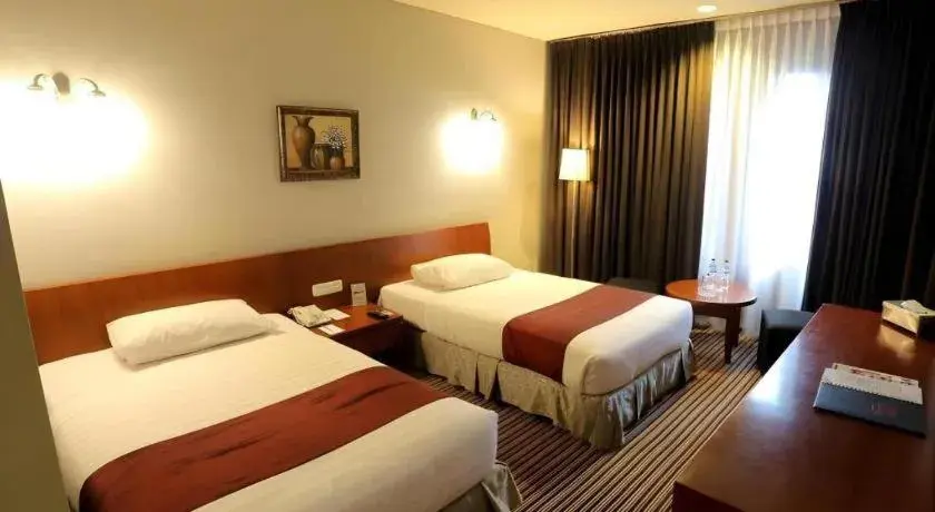 Bed in Kenari Tower Hotel Bed in Kenari Tower Hotel