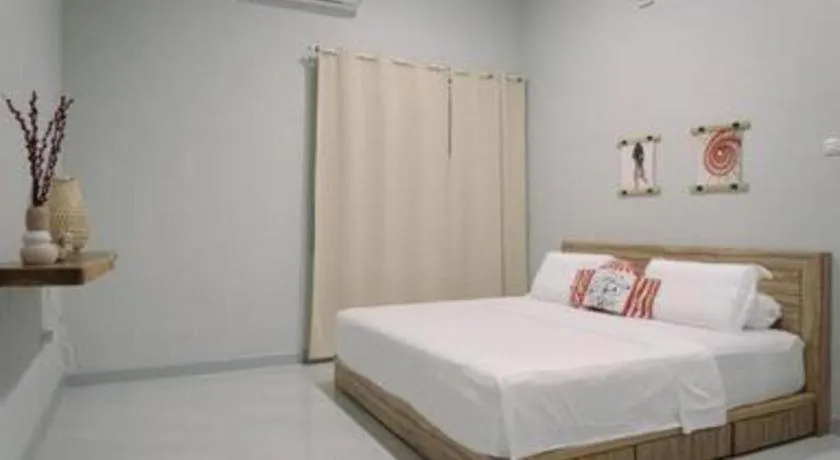 Bed in Kenari Tower Hotel