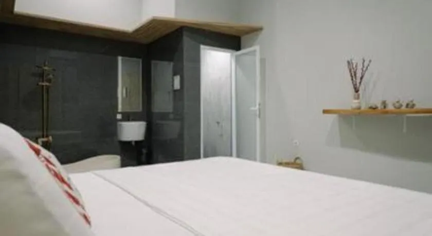 Bed in Kenari Tower Hotel