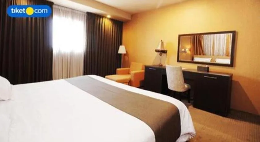 Bed in Kenari Tower Hotel