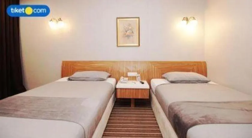 Bed in Kenari Tower Hotel