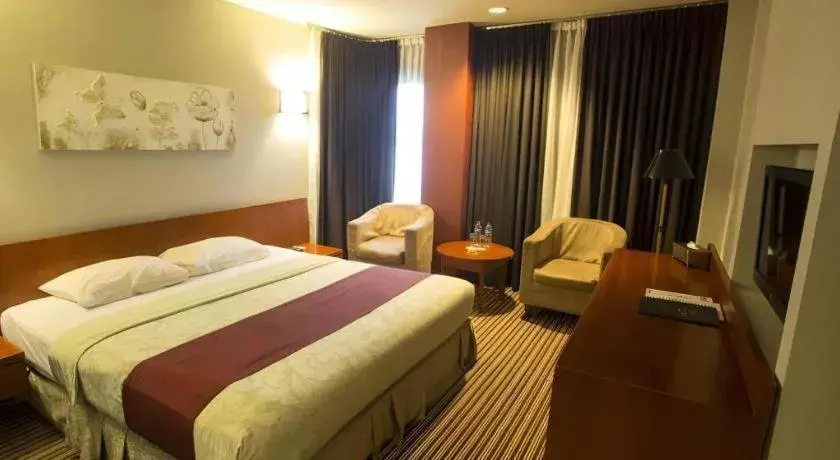 Bed in Kenari Tower Hotel Bed in Kenari Tower Hotel