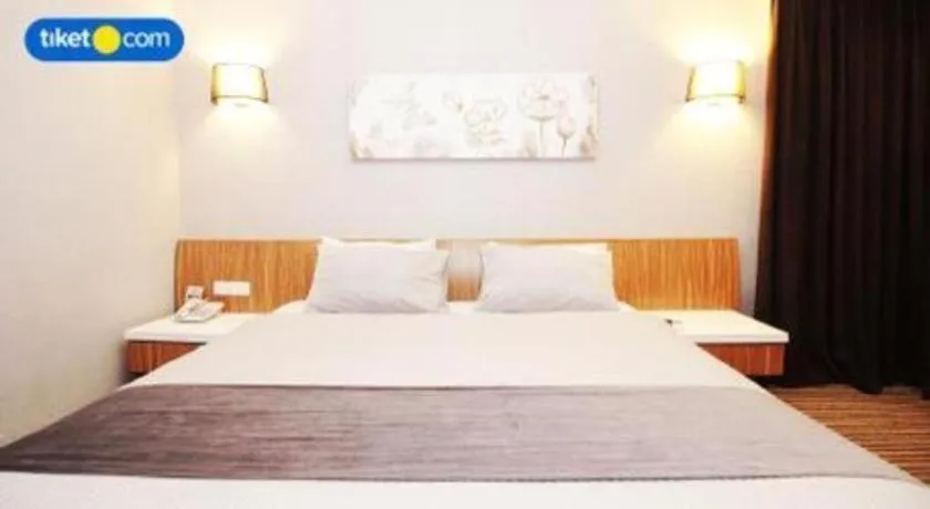 Bed in Kenari Tower Hotel