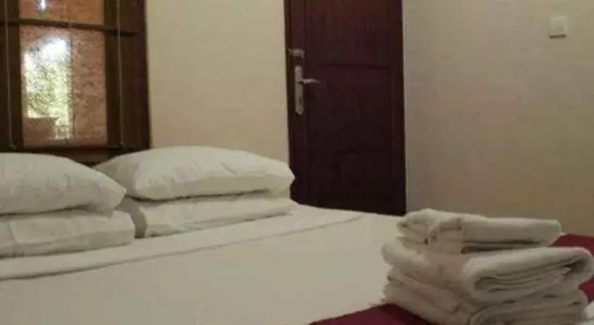 Bed in Al-Isha Dharamshala Bed in Al-Isha Dharamshala