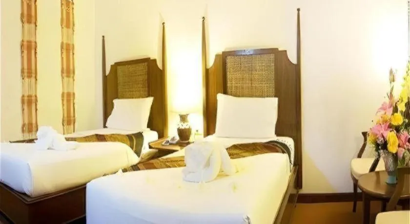 Bed in Phuphaya Resort Pattaya