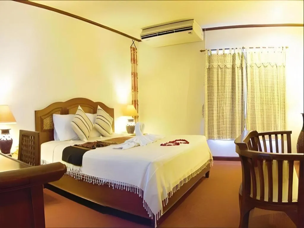 Bed in Phuphaya Resort Pattaya