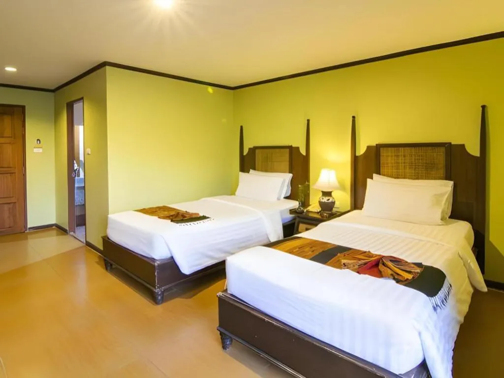Bed in Phuphaya Resort Pattaya