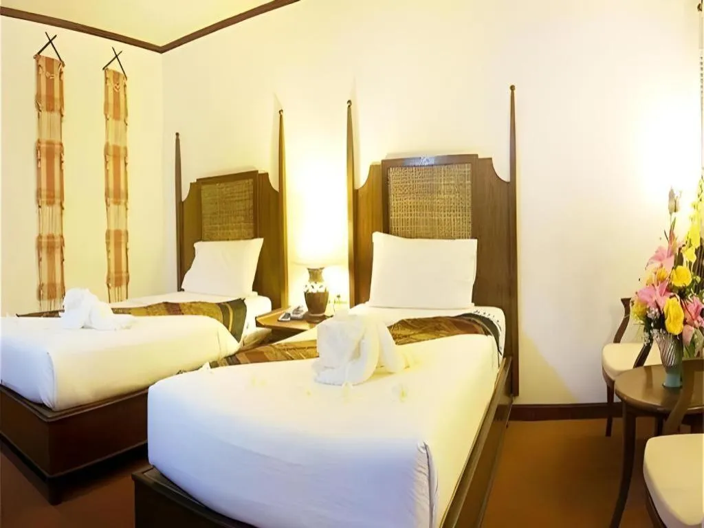 Bed in Phuphaya Resort Pattaya