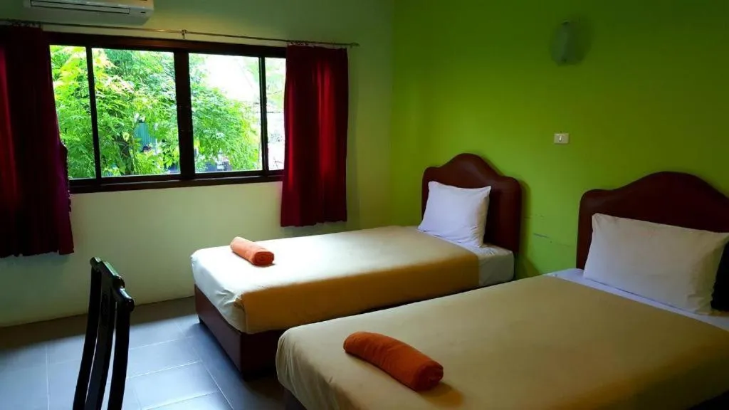 Bed in Baan Suan Sook Resort