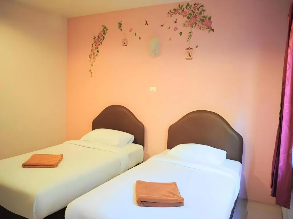 Bed in Baan Suan Sook Resort