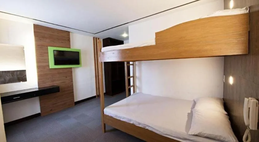 Bed in Hotel Henrico Kisad