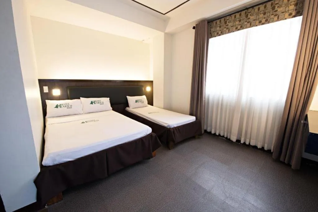 Bed in Hotel Henrico Kisad