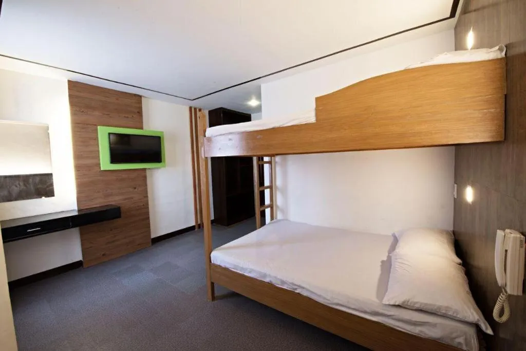 Bed in Hotel Henrico Kisad