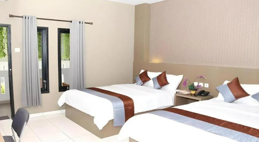 Bed in Grand Mutiara Hotel