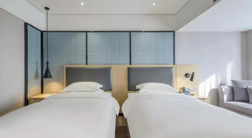 Bed in Echarm Hotel Beihai Railway Station