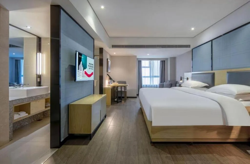 Bed in Echarm Hotel Beihai Railway Station