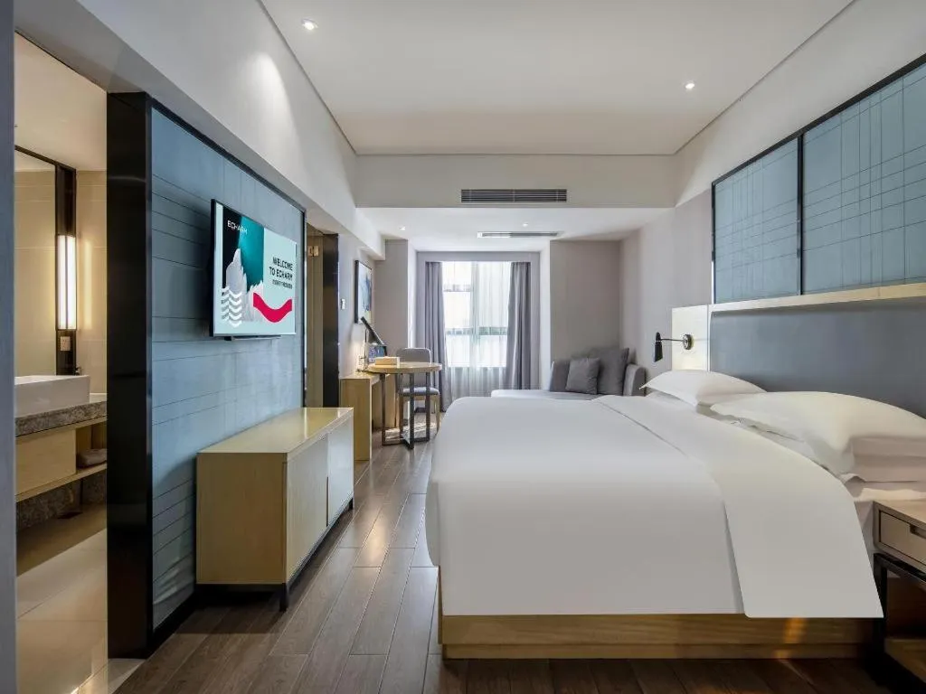 Bed in Echarm Hotel Beihai Railway Station