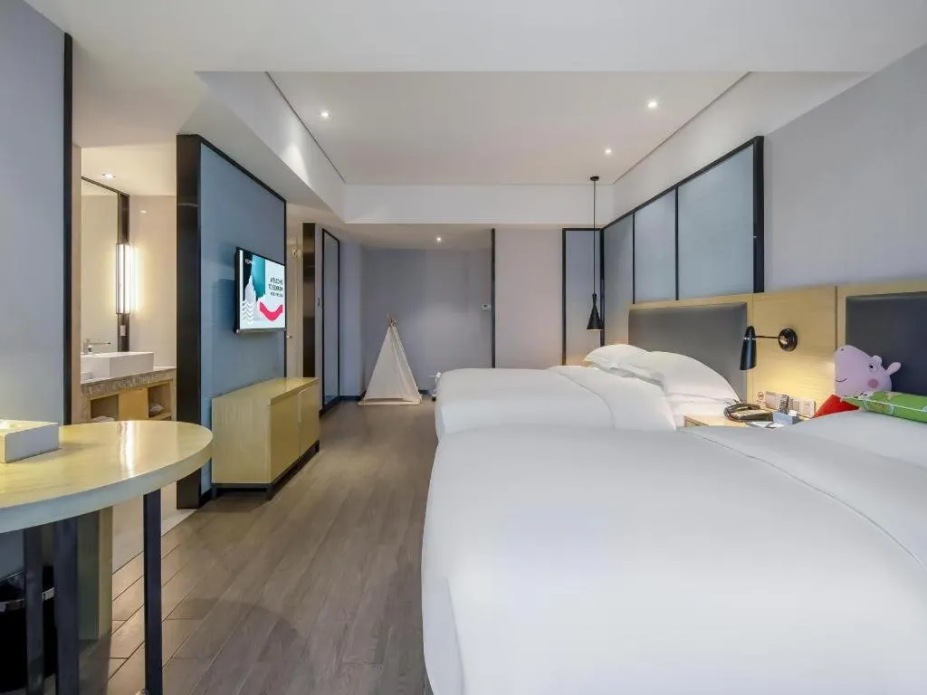 Bed in Echarm Hotel Beihai Railway Station