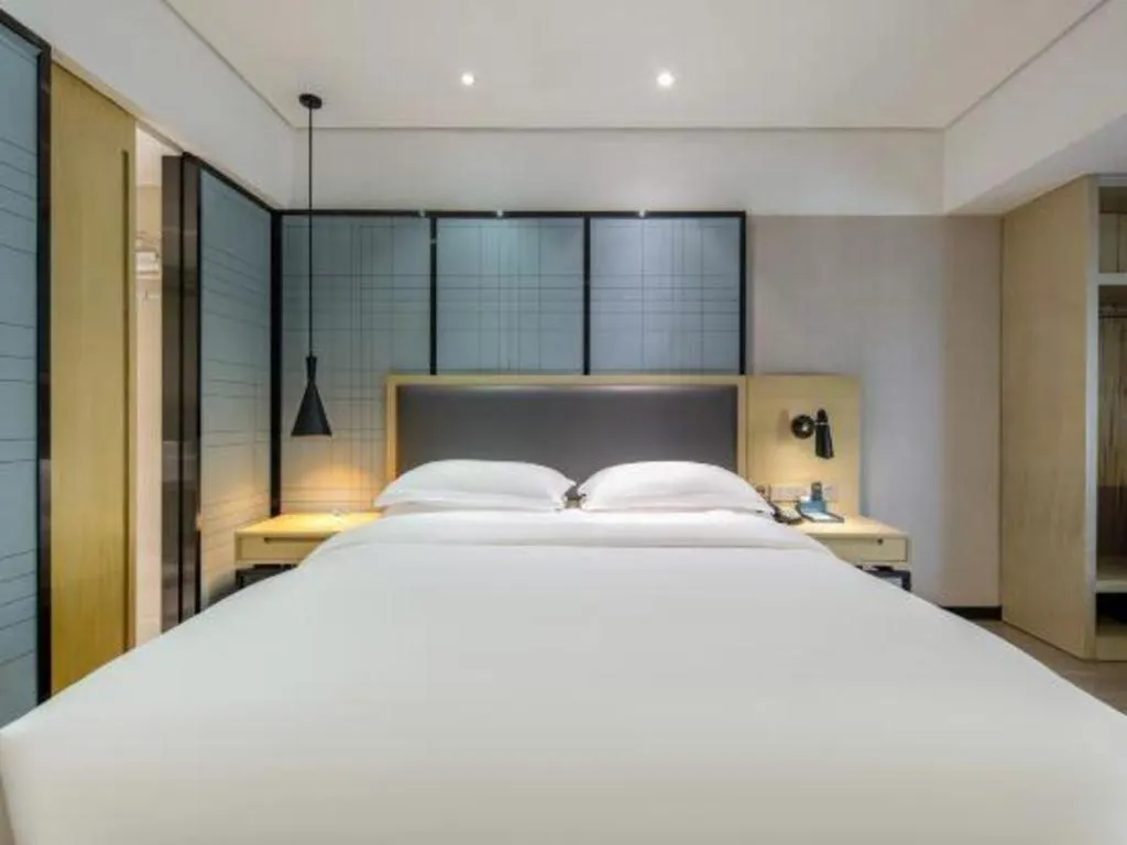 Bed in Echarm Hotel Beihai Railway Station