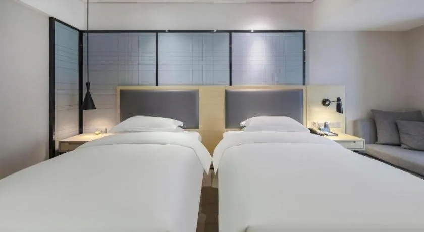 Bed in Echarm Hotel Beihai Railway Station
