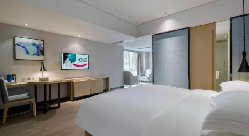 Bed in Echarm Hotel Beihai Railway Station