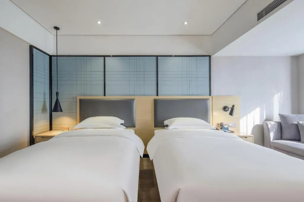 Bed in Echarm Hotel Beihai Railway Station