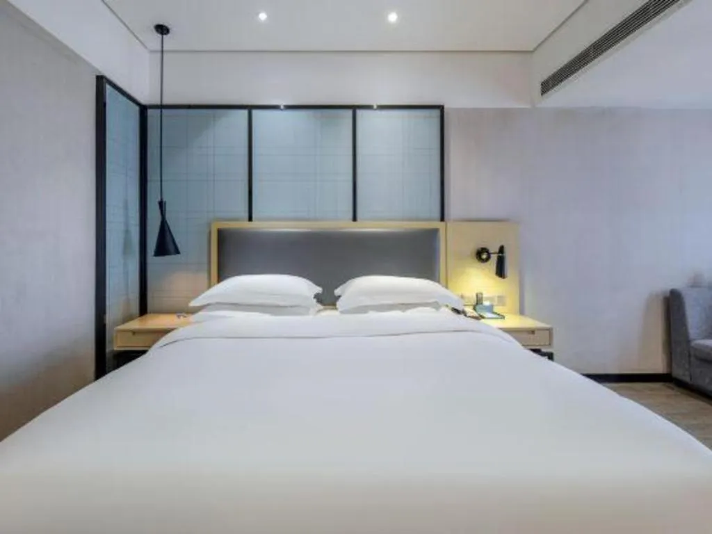 Bed in Echarm Hotel Beihai Railway Station